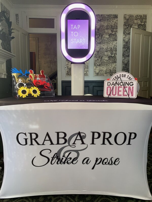 Couple posing at the photo booth