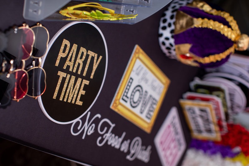 Guests having fun with photo booth props